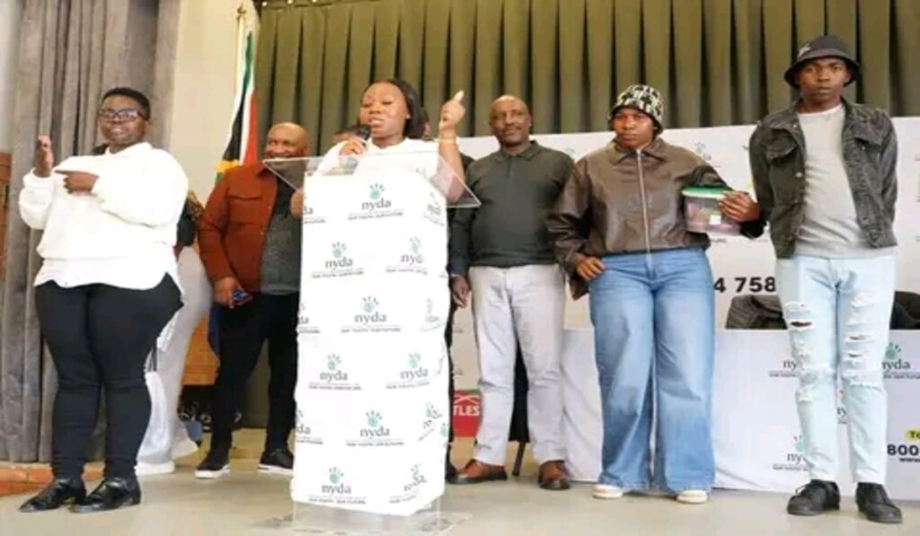 youth unemployment feature image with leaders speaking on a stage setting