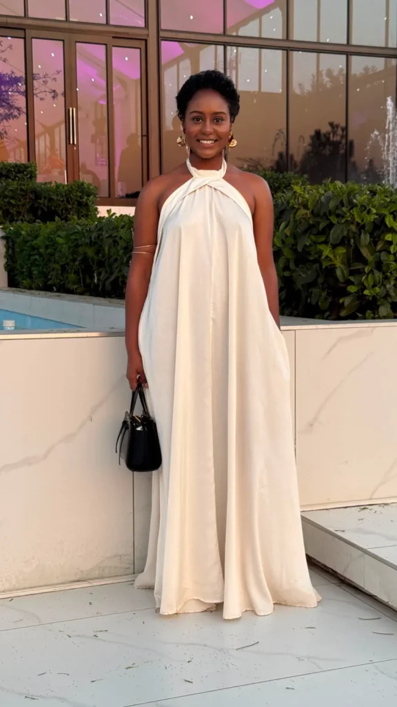 glamour feeder image of the writer wearing a white flowing gown