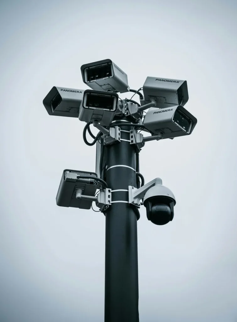 public urination decorative image for illustration purposes of a streetpole with CCTV cameras attached to it