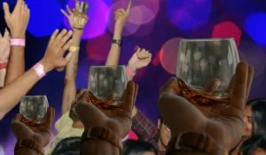 Alcohol glasses and bottles representing the role of alcohol in family and social life.