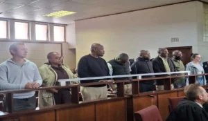 electricity fraud accused appearing on the docks